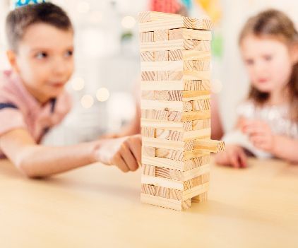 Two kids playing Jenga Blocks - Kaldan Samudra Palace